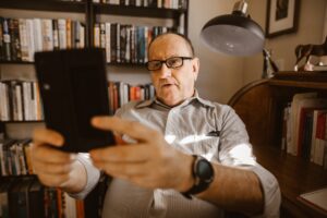 Man living with dementia struggling to read his ipad